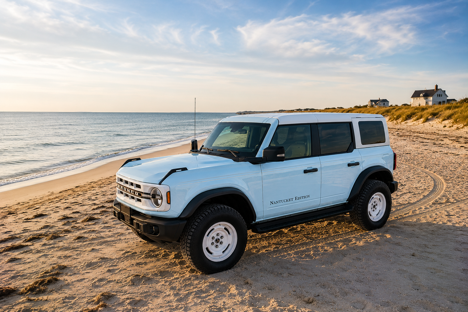 Ford Bronco Nantucket Edition on beach at golden hour with ocean and beach houses