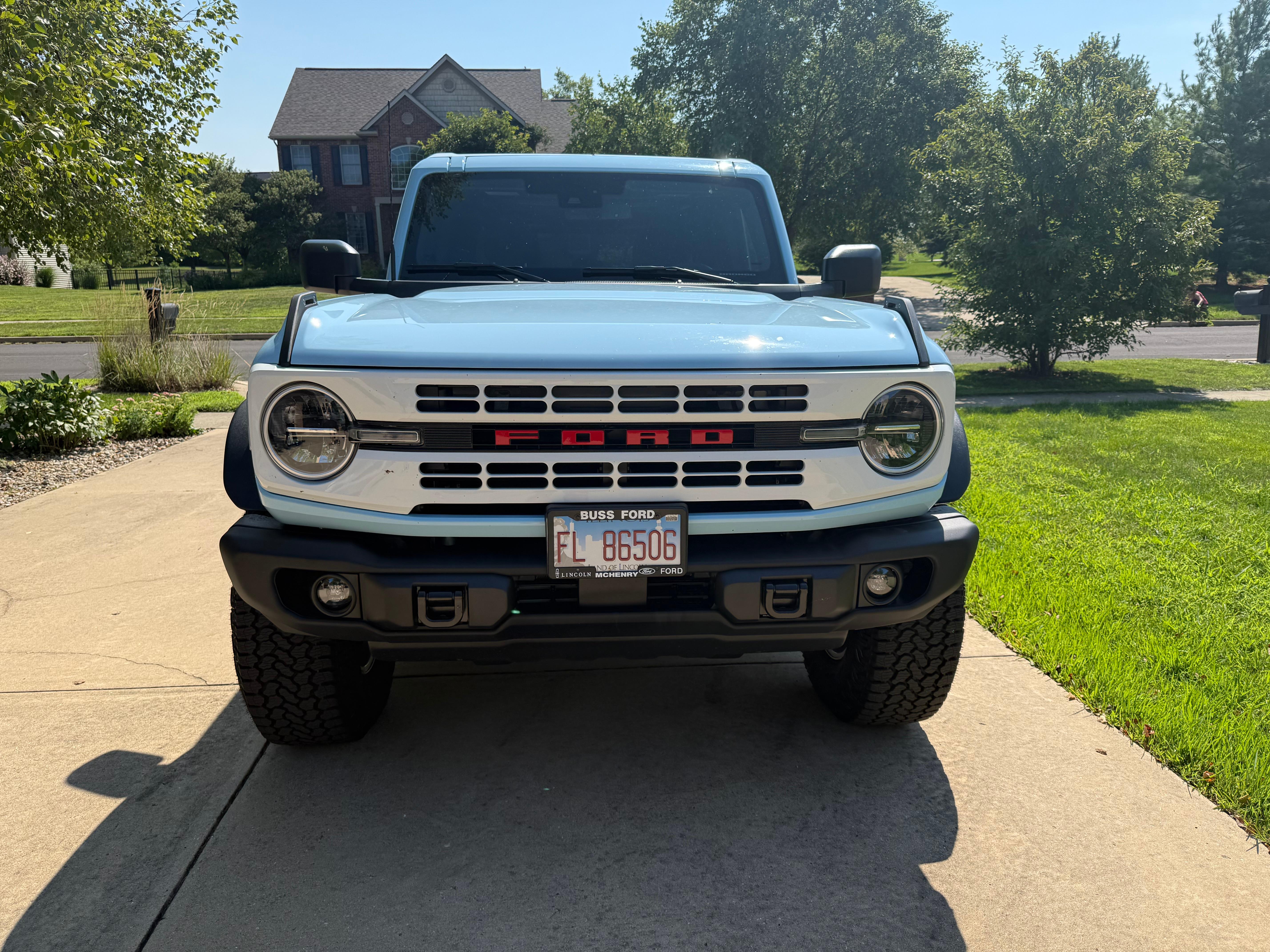 Direct front view of Ford Bronco showing grille and headlights