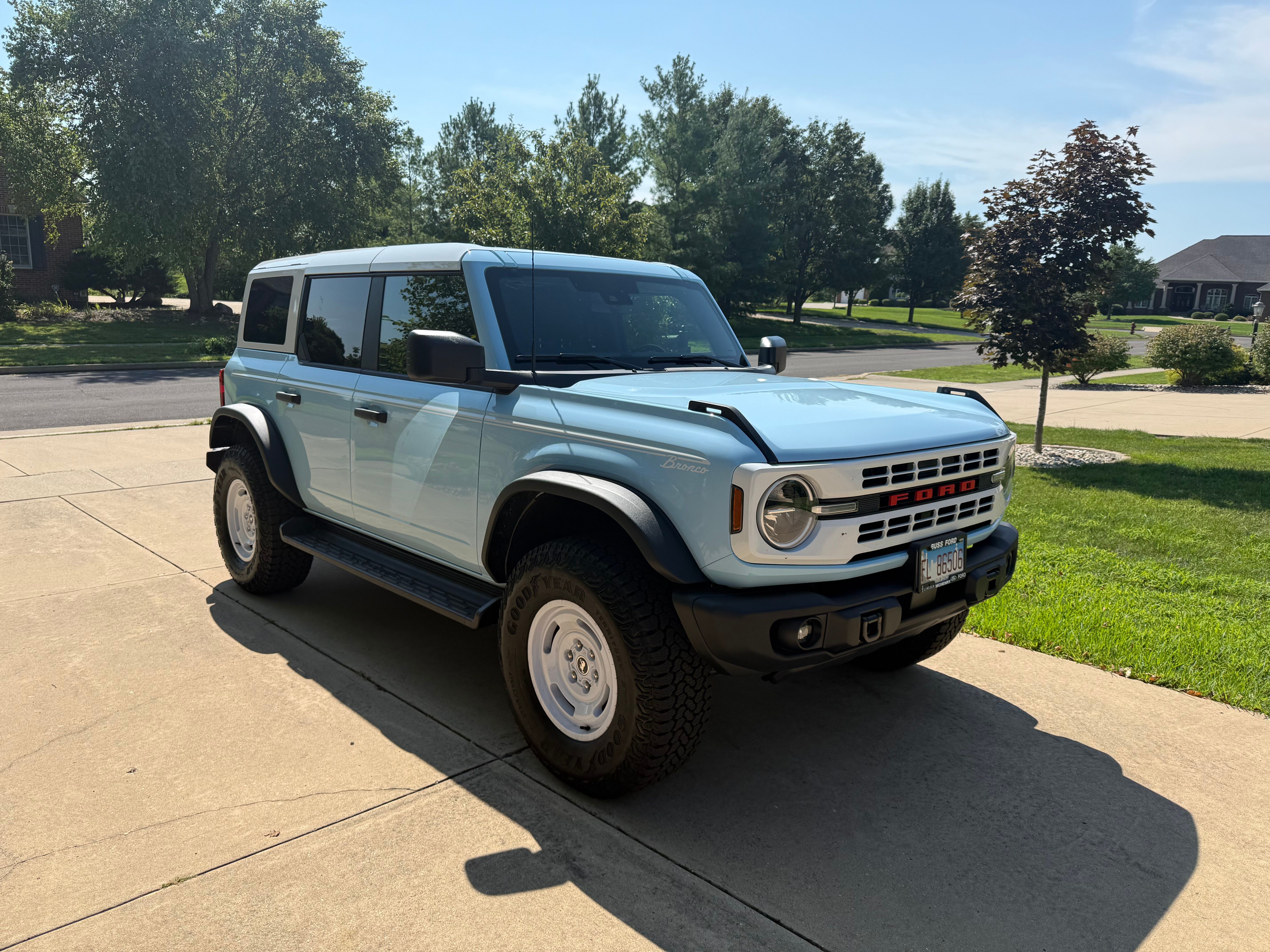 Ford Bronco front three-quarter view in suburban setting